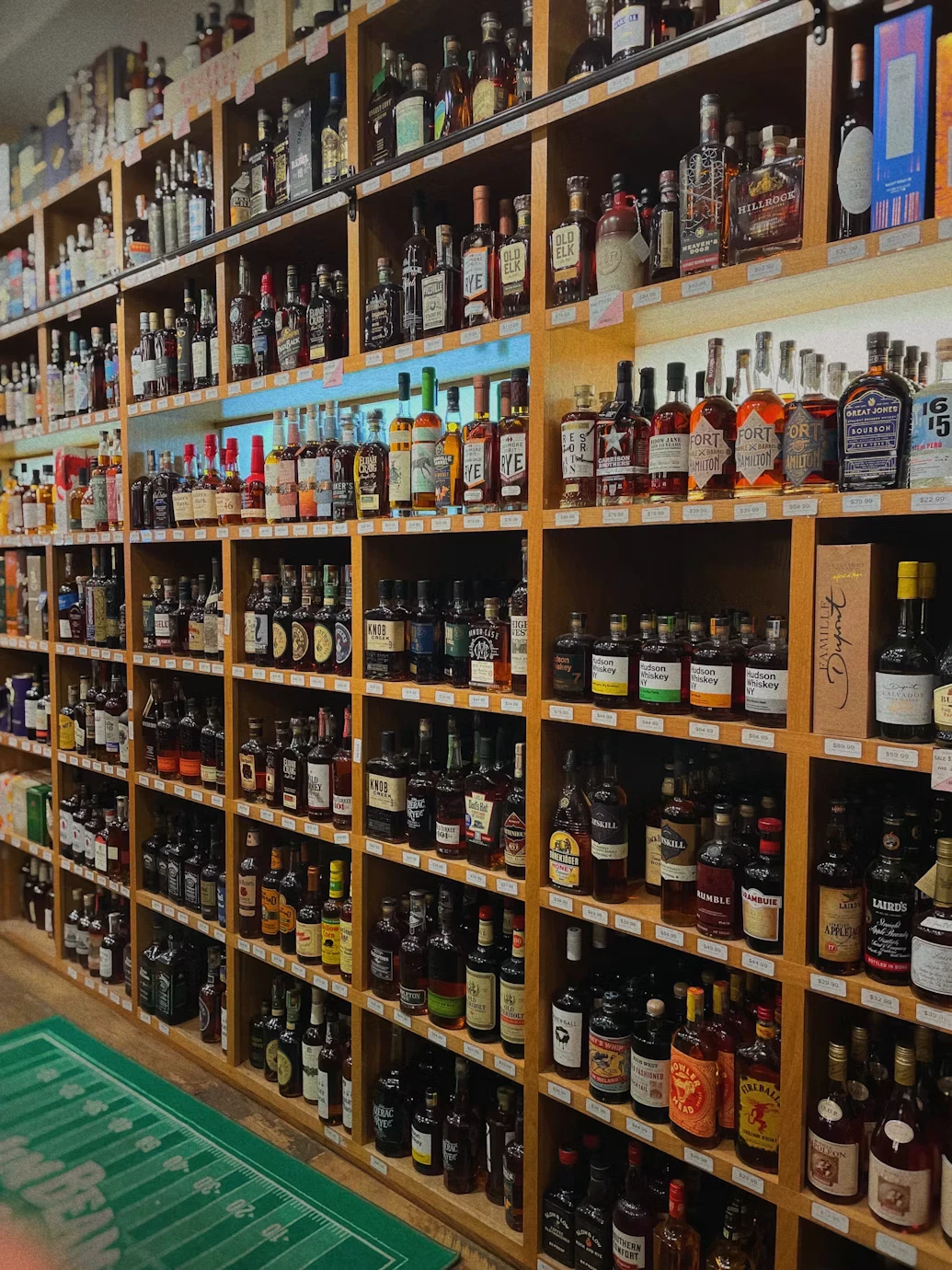 Shelves stocked with bottles of spirits